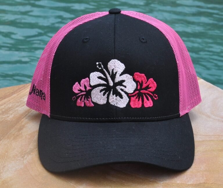 black and pink baseball hat with 3 pink hibiscus flowers on the front. customized with name on the side