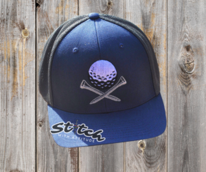Golf ball and tees on a trucker hat Golf ball and tees on a trucker hat