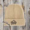 Tan beanie with adventure awaits embroidered on it