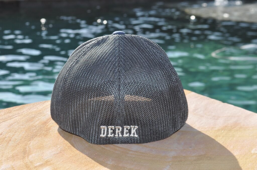 Name embroidered on the back of a flexfit hat