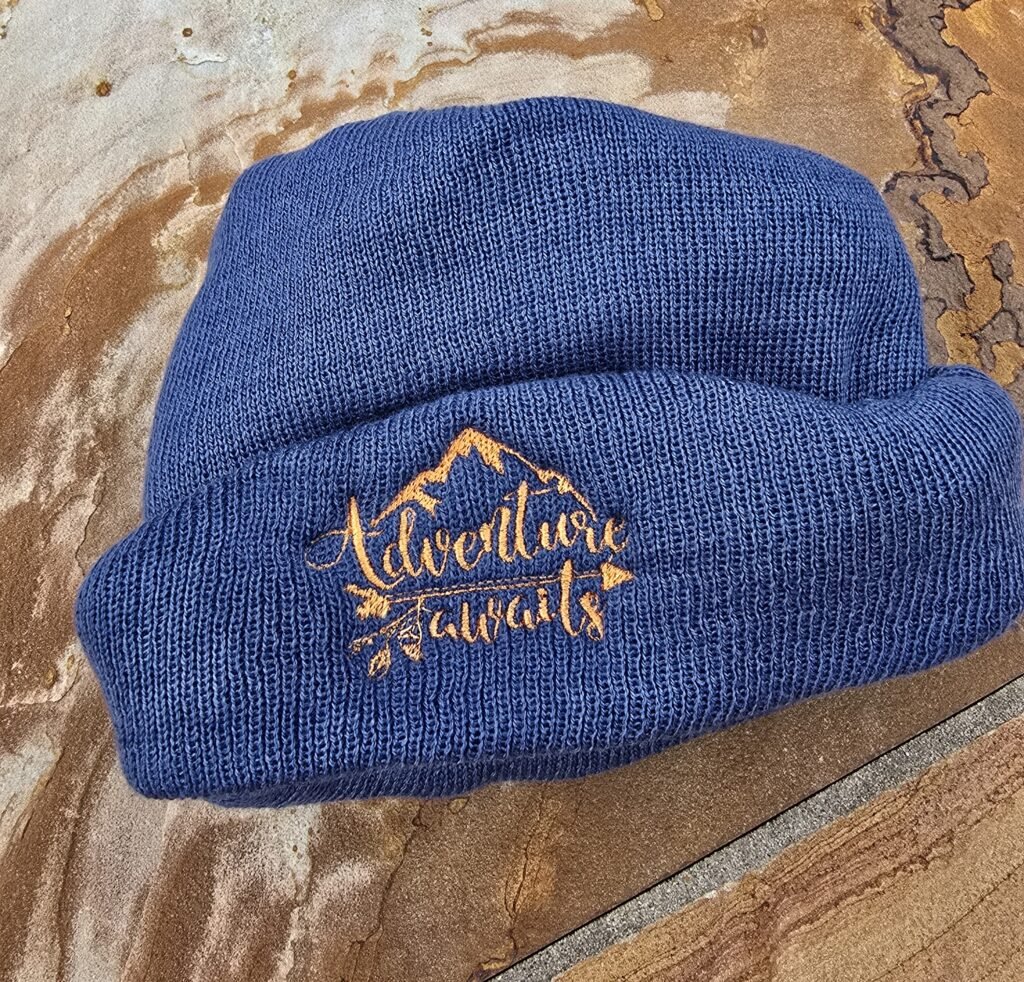 Beanie with adventure awaits embroidered on the front