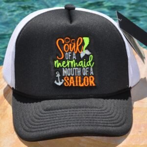 Black and white foam trucker hat with "Sour of a mermaid mouth of a sailor" embroidered on the front
