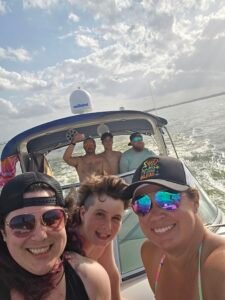 Family boating on the lake enjoying the sun