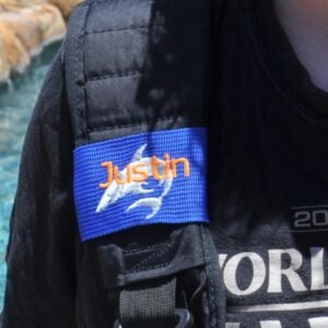 Luggage tag wrap displayed on bag strap