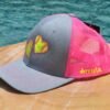Side view of pink doubt softball hat with name example