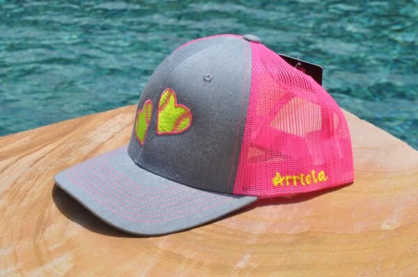 Side view of pink doubt softball hat with name example