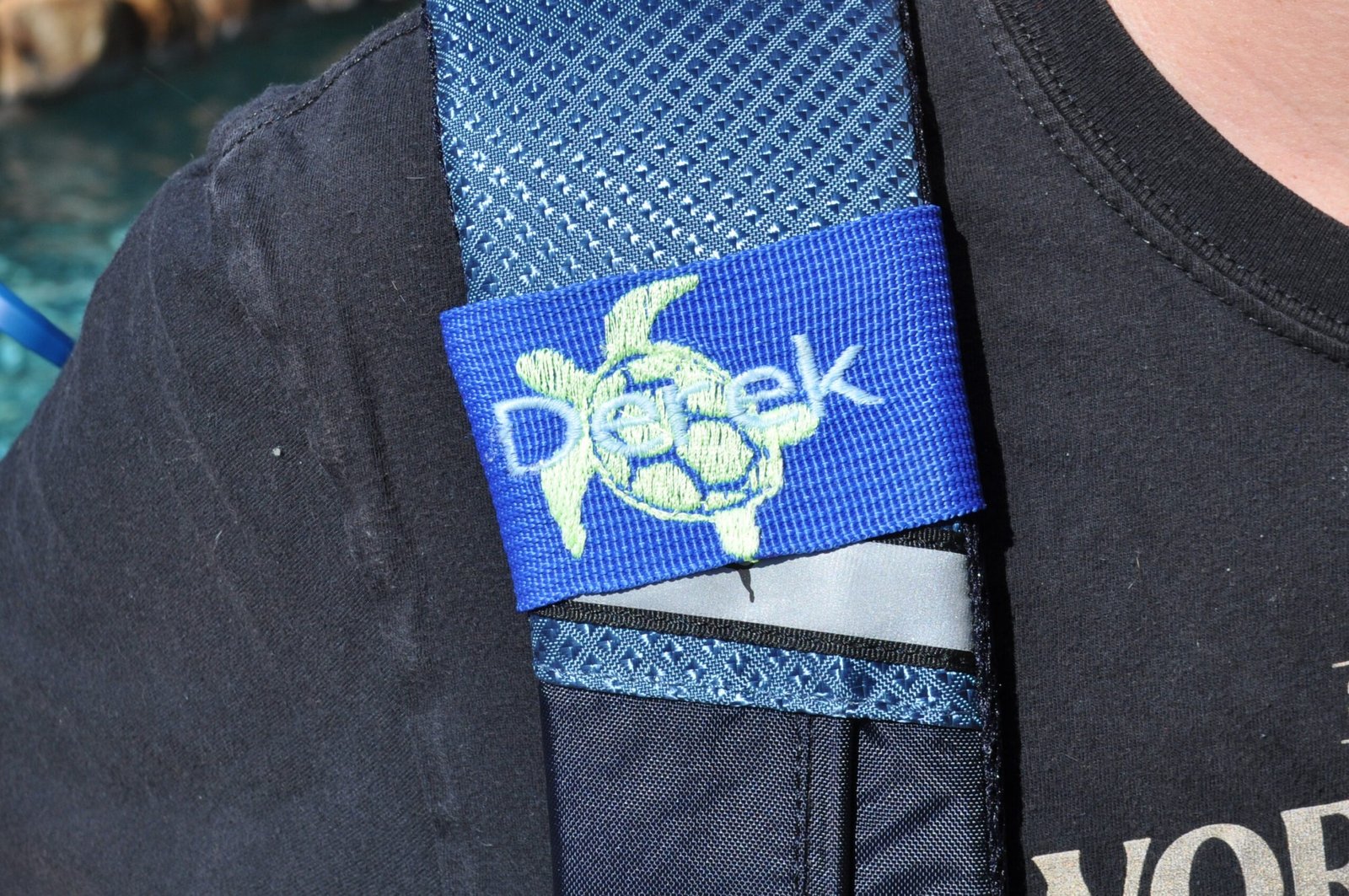 Luggage tag wrap displayed on bag strap Custom Embroidered Luggage Tag – Wrap-Around Velcro Style