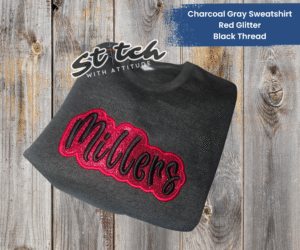 Red glitter and black embroidery on a charcoal sweatshirt