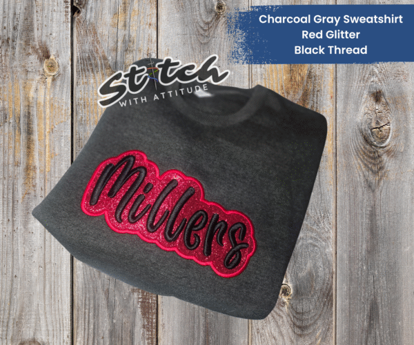 Red glitter and black embroidery on a charcoal sweatshirt Red glitter and black embroidery on a charcoal sweatshirt