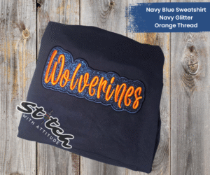 Navy sweatshirt with navy glitter and orange thread