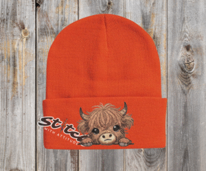 Orange Baby highland cow with beanie