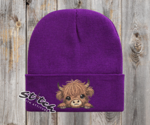 Purple Baby highland cow with beanie
