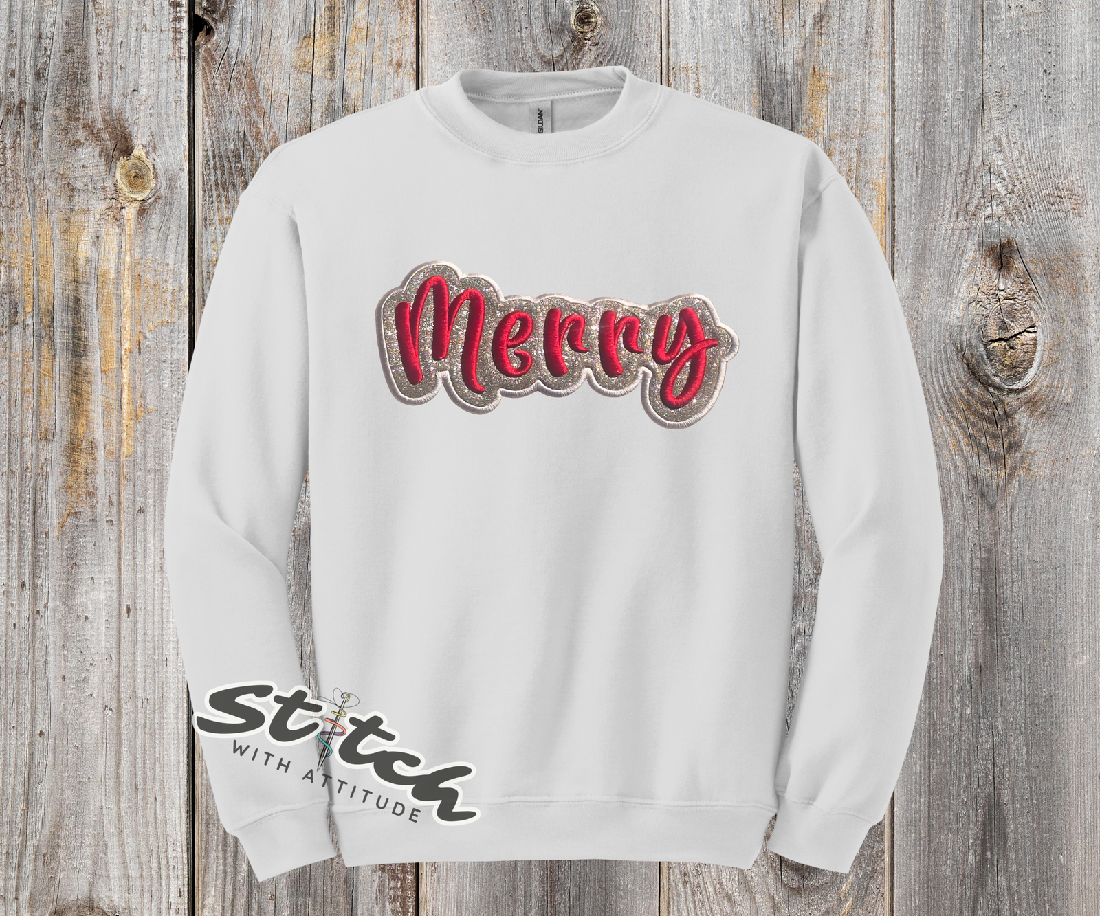 Holiday sweatshirt with glitter vinyl and the word Merry in puff embroidery on the front white sweatshirt