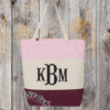Maroon tricolor canvas bag with monogram on the front Maroon tricolor canvas bag with monogram on the front