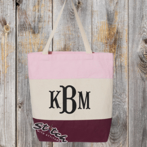 Maroon tricolor canvas bag with monogram on the front