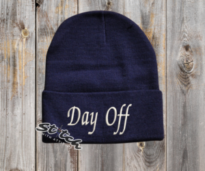 Navy beanie with the embroidery on the front