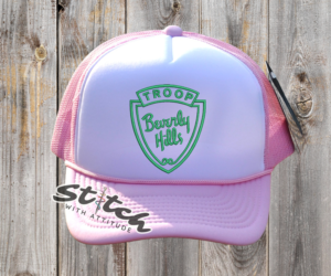 Troop Beverly Hills Has light pink with green logo