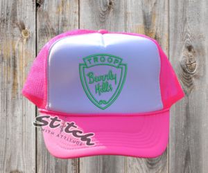 Troop Beverly Hills Has bright pink with green logo