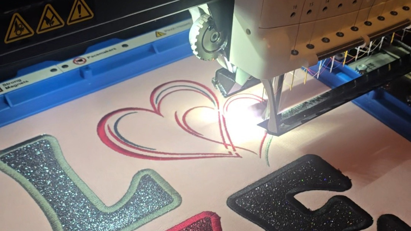 machine stitching out a design