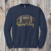 Game Day Glitter Football Embroidered Sweatshirt. You already live at the field. This is what you wear there. A glitter football applique, Game Day in stitched script, and the thre