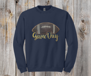 Game Day Glitter Football Embroidered Sweatshirt. You already live at the field. This is what you wear there. A glitter football applique, Game Day in stitched script, and the thre