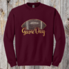 Game Day Glitter Football Embroidered Sweatshirt. You already live at the field. This is what you wear there. A glitter football applique, Game Day in stitched script, and the thre