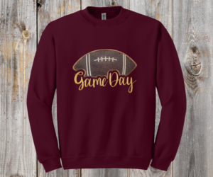 Game Day Glitter Football Embroidered Sweatshirt. You already live at the field. This is what you wear there. A glitter football applique, Game Day in stitched script, and the thre