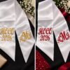 Custom Embroidered HOCO Bouquet Ribbon - Homecoming-Bouquet-Sash-3.jpg Homecoming bouquet sash in white satin, embroidered HOCO 2026 on one side and a monogram on the other.