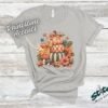 Stacked Pumpkins Fall Tee with Rhinestone Accents - Stacked-Pumpkins-Rhinestone-Tee-3.jpg Stacked Pumpkins Fall Tee with Rhinestone Accents. Three painted pumpkins under a gingham bow, with mushrooms, sunflowers and stars, and real rhinestones set by hand across the des
