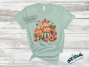 Stacked Pumpkins Fall Tee with Rhinestone Accents - Stacked-Pumpkins-Rhinestone-Tee-5.jpg Stacked Pumpkins Fall Tee with Rhinestone Accents. Three painted pumpkins under a gingham bow, with mushrooms, sunflowers and stars, and real rhinestones set by hand across the des