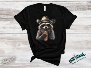 Cowboy Raccoon Rhinestone Tee - Cowboy-Raccoon-Rhinestone-Tee-01.png Cowboy Raccoon Rhinestone Tee. A raccoon in a cowboy hat, sunglasses and bandana, sipping from a leopard print cup. DTF print on black with rhinestones set by hand, standard or ext